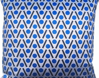 May include: A blue and gray patterned throw pillow with a geometric design of circles and diagonal lines.