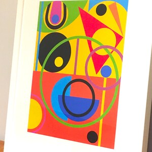 May include: Abstract geometric art print featuring a red, yellow, green, blue, and black color scheme. The print features circles, semi-circles, triangles, and lines.