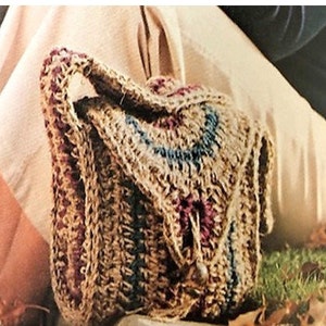 May include: A crocheted bag with a flap closure, featuring a mix of brown, blue, and burgundy yarn. The bag has a handle and a drawstring closure. The text "Fast & Easy" is at the top of the image.