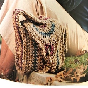 May include: A crocheted bag with a flap closure, featuring a mix of brown, blue, and burgundy yarn. The text "Fast & Easy" and "70's Crochet Pattern" are displayed. The bag is shown in a natural outdoor setting.