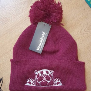 Cute peeking otter embroidered bobble hat or beanie made to order in your choice of colour and thread