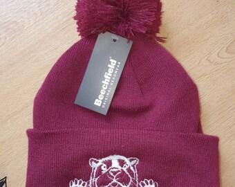 Cute peeking otter embroidered bobble hat or beanie made to order in your choice of colour and thread
