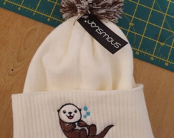 Cute kawaii embroidered sea otter cream bobble hat bespoke gift idea
