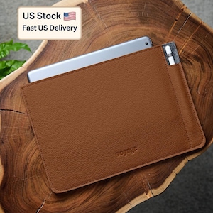 May include: A brown leather tablet sleeve with a tablet inside and a stylus in a side pocket. The sleeve has the word "voyage" embossed on the front. The image also includes a "US Stock" and "Fast US Delivery" label.