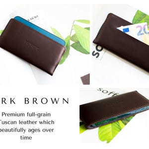May include: Dark brown leather wallet with the embossed word "voyage". The wallet is shown with a blue phone inside and also with a twenty euro bill. The text "Premium full-grain Tuscan leather which beautifully ages over time" is also visible.