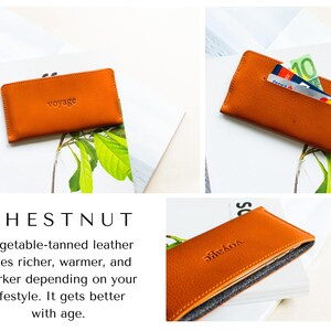 May include: Chestnut-colored leather wallet with the word "voyage" embossed on the front. The wallet is shown with cards and cash inside. The wallet is made of vegetable-tanned leather.