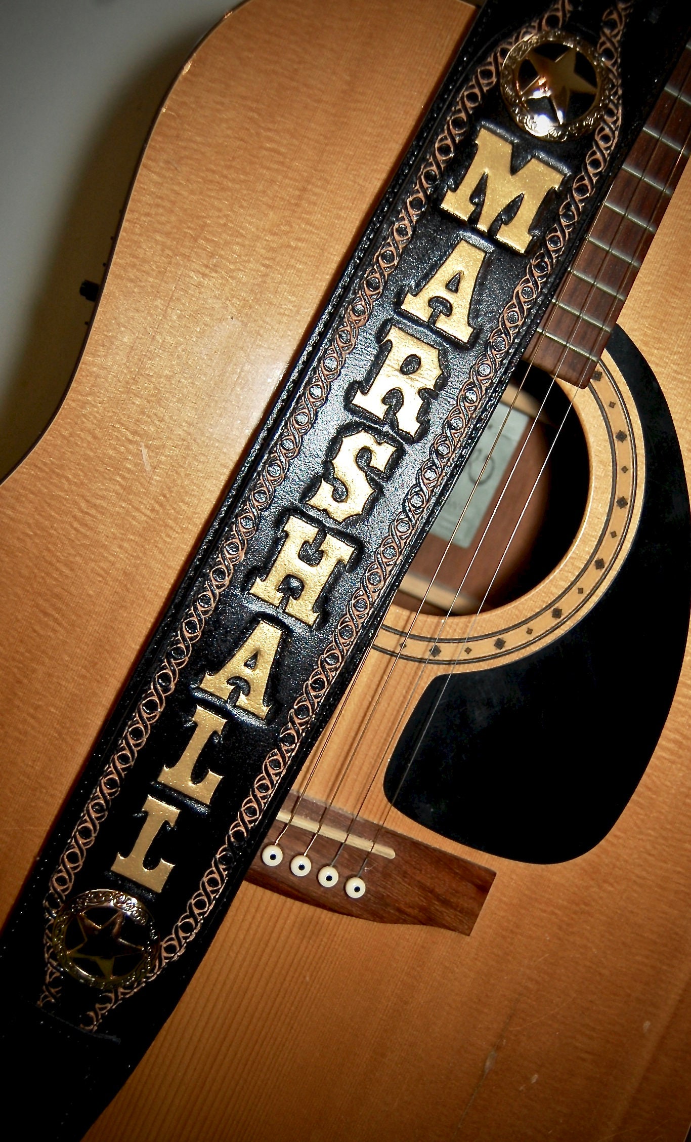 black and gold guitar strap
