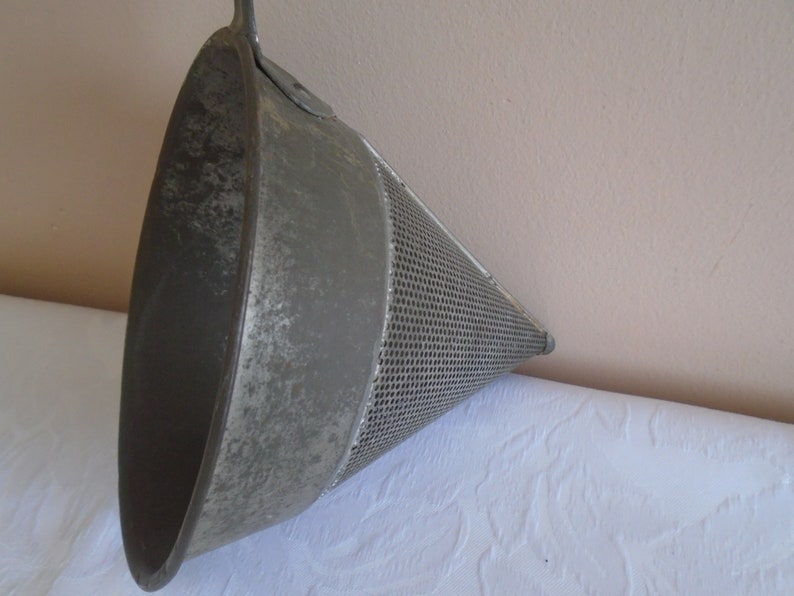 galvanised metal fruit strainer