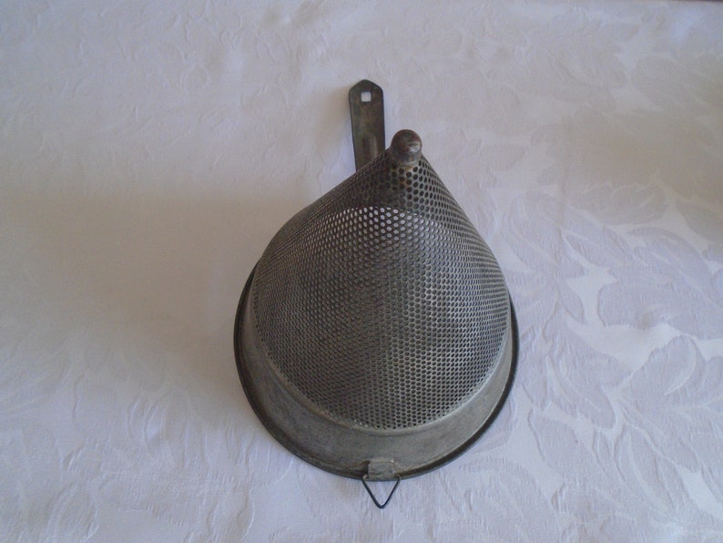 galvanised metal fruit strainer