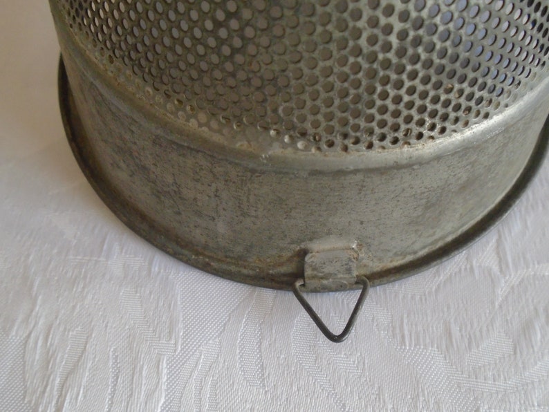 galvanised metal fruit strainer