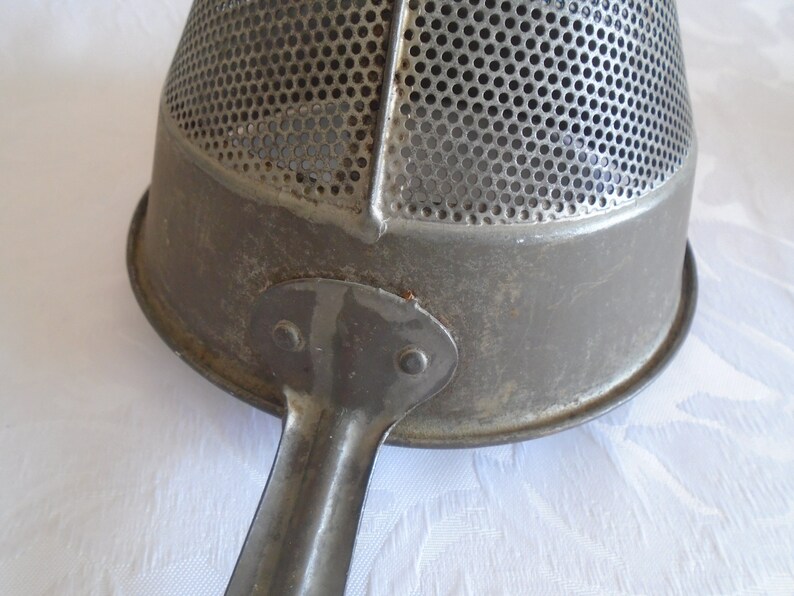 galvanised metal fruit strainer