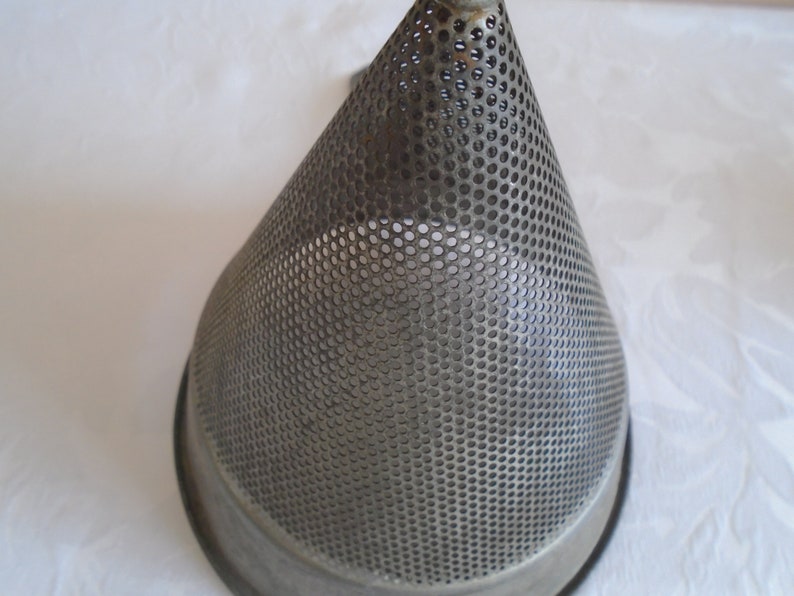 galvanised metal fruit strainer