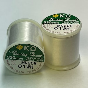 May include: Two spools of K.O. Beading Thread, 100% nylon, in white. The spools have green labels with text including "330dtex" and "Made in Japan." The thread is from Kobayashi Co., Ltd.