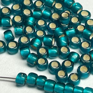 Toho #27BDF matte blue zircon silver lined round seed beads