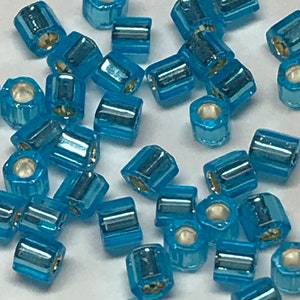 Toho #23B 8/0 Hex silver lined aqua blue, 2-cut, 20 gms
