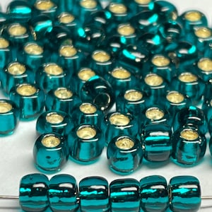 Toho #27BD silver lined blue zircon round seed beads