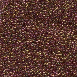 May include: A close-up view of a large quantity of small, iridescent, copper-colored seed beads. The beads are arranged in a random pattern, creating a shimmering, metallic effect.