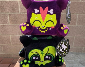 Hex & Jinxy Cats GLOW in the DARK plushies, the weird and cute plush witch cat and voodoo cat plush mashups by Squaredy Cats. They Glow!