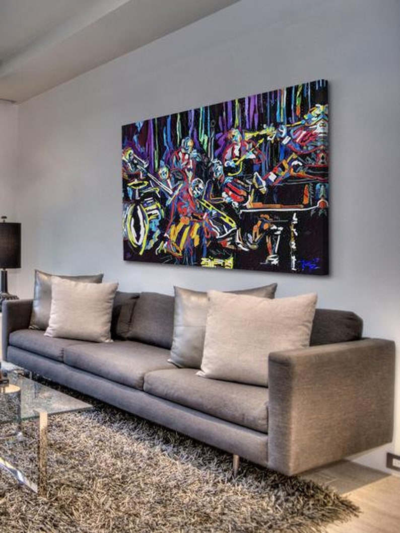 May include: A colorful abstract painting of a band playing music. The painting is done in a vibrant style with bold colors and thick brushstrokes. The band members are depicted in a dynamic pose, with their instruments raised in the air. The painting is set against a dark background, which creates a sense of energy and excitement.