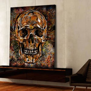 May include: A colorful abstract painting of a skull with intricate floral patterns in shades of orange, yellow, green, and brown.