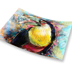 May include: A colorful painting of a toucan with a large beak. The toucan is painted in shades of yellow, red, black, and white. The background is a vibrant blue and green with splashes of color.