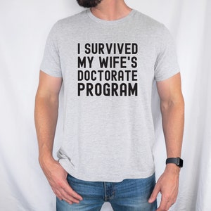 I Survived My Wife's Doctorate Program Shirt, Doctorate Shirt, Funny PHD Graduation Gift, PHD Tee, Sarcastic Gift for PhD Husband, Graduate image 2
