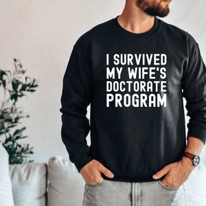 I Survived My Wife's Doctorate Program Shirt, Doctorate Shirt, Funny PHD Graduation Gift, PHD Tee, Sarcastic Gift for PhD Husband, Graduate image 3