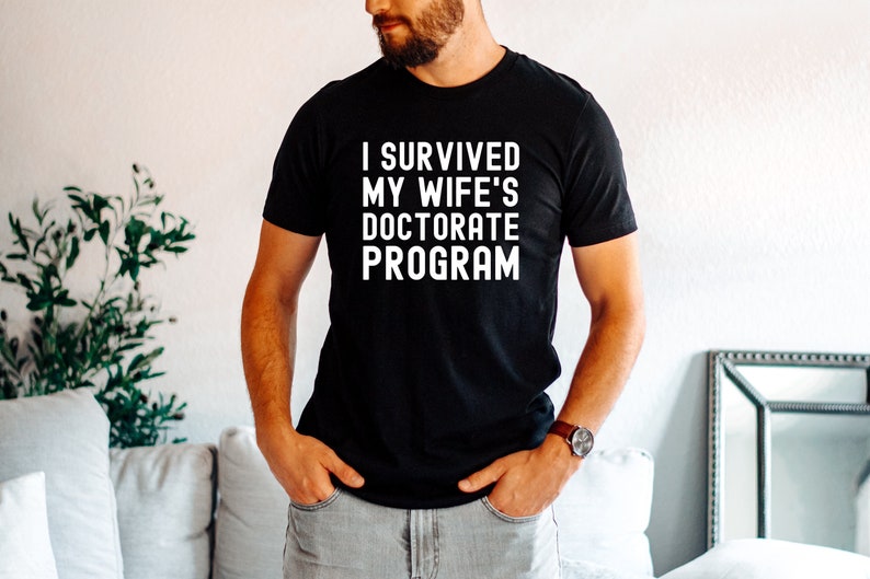 I Survived My Wife's Doctorate Program Shirt, Doctorate Shirt, Funny PHD Graduation Gift, PHD Tee, Sarcastic Gift for PhD Husband, Graduate image 1