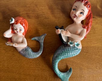 set of two mermaids