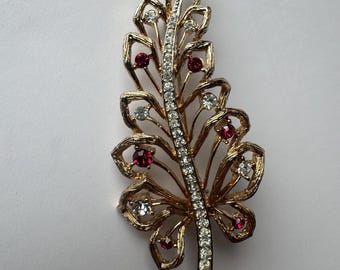 older Avon brooch leaf feather gold tone red clear rhinestones