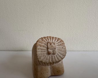 Small lion stone carving