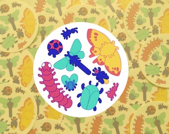 May include: A white circle with a variety of colorful insect illustrations, including a ladybug, a caterpillar, a dragonfly, a beetle, a moth, and a firefly.