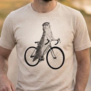 Otter Riding Cyclocross Bike T-Shirt | Vintage Animal Cycling Graphic, Unisex Soft Cotton Tee