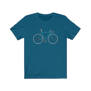 May include: A teal blue t-shirt with a white silhouette of a bicycle on the front.