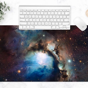 May include: A dark blue and purple nebula with a bright white center, surrounded by a field of twinkling stars. This image is perfect for a desktop background or a space-themed print.