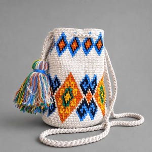 A small crocheted bag with a traditional Ukrainian pattern