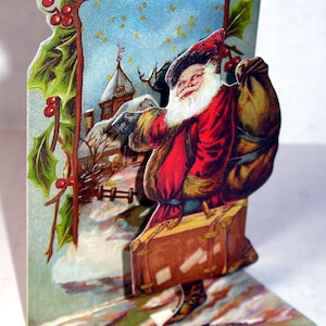 Hermoso soporte para tarjeta navideña 3D HITCH HIKING SANTA para exhibir en perfecto estado Vintage Merrimack Pulbishng Co