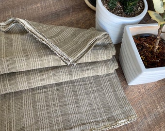 Olive shade ,The Chiangmai cotton woven,natural cotton with black dot threads and white line slight pattern,soft ,cotton woven sell by yards