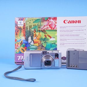 Cámara digital compacta Canon PowerShot s60 - 5 megapíxeles - Zoom óptico de 3,6x - Flash - En caja con instrucciones y tarjeta de memoria