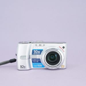 Panasonic Lumix DMC-TZ1 Compact Digital Camera - 5 Mega Pixels - 10x Optical Leica Zoom Lens - Flash