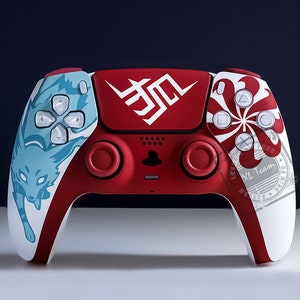 May include: A red and white custom designed PlayStation 5 controller with a blue and white fox design on the left side and a white and red floral design on the right side. The controller has red buttons and a red PlayStation logo.