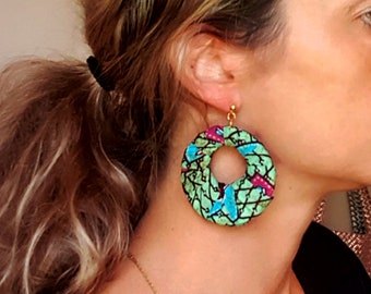 Large African wax fabric hoop earrings in blue, mauve, and green.