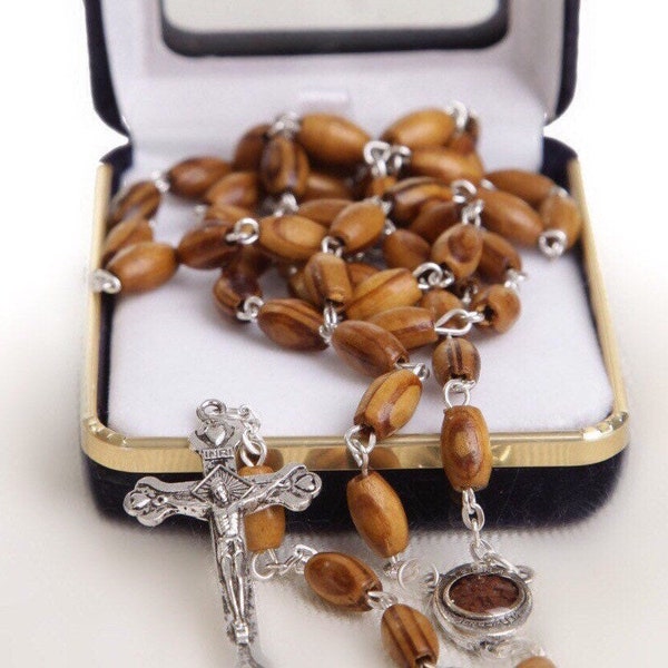 Holy Land Olive Wood Rosary with a Silver Cross and contains Holy Soil from the Holy Land where Jesus walked inside a premium velvet box.