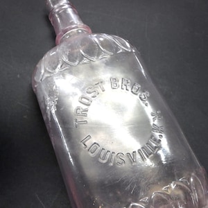 Antique Trost Bros. Louisville KY Whiskey Bottle – Amethyst Sun Colored Glass, ca. 1890s–1910s