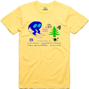 May include: Yellow t-shirt featuring a pixelated graphic of a blue figure skiing, a truck, a pine tree, and the text "Horace Goes Skiing" and "Presented by Psion Computers and Melbourne House".