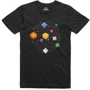 May include: Black t-shirt featuring a graphic of a solar system made up of colourful dice. The dice are orbiting a central star, with the text "T-SHIRT LEGENDS" at the top.