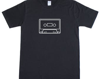 May include: A black t-shirt with a white outline of a cassette tape.
