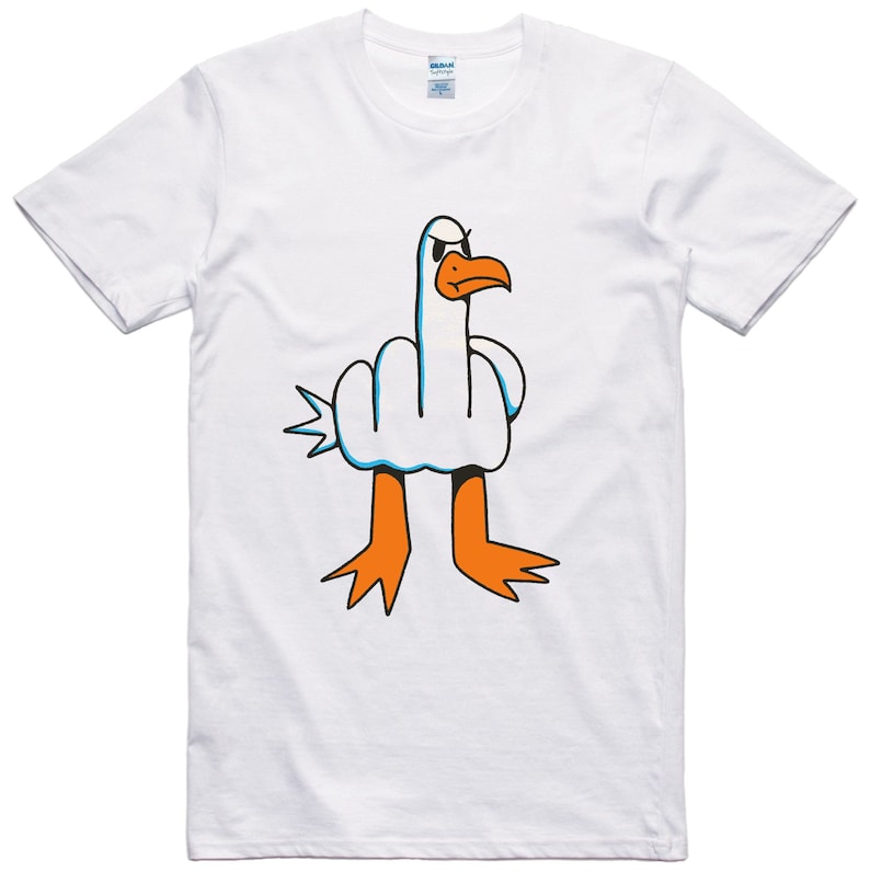May include: White t-shirt with a cartoon image of a bird giving the middle finger.