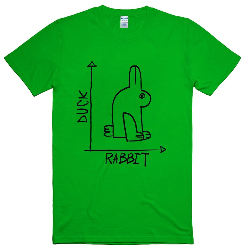 May include: Bright green t-shirt with a black line drawing of a rabbit that could also be a duck. The words "DUCK" and "RABBIT" are written in black on the shirt.
