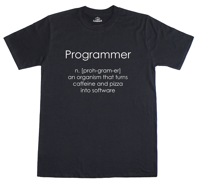 May include: Dark grey t-shirt featuring the word "Programmer" in white, with a definition below: "an organism that turns caffeine and pizza into software." The shirt has a crew neck and short sleeves.